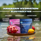 Two packages of Hawaiian Hydration electrolytes on a plate with fruits and sea salt in water.